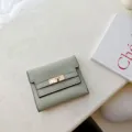 Minimalist sage green short PU leather wallet for women with elegant metal lock design. - Green