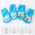 Cute blue anti-slip pet socks for small dogs and cats with paw print and bow knot designs. - S / Blue