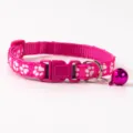 Pink cat collar with cute white paw prints, quick release buckle, and a lovely bell. - Paw Print Style / Rose Red
