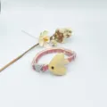 Close-up detail of cute cat collar featuring yellow fish accessory and red plaid strap. - 1.0 (19-32) cm / Red