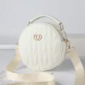 Chic white round quilted crossbody bag with top handle and wide strap for women fashion style. - White