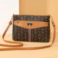 Women's vintage monogram cross-body shoulder bag with front flap pocket and adjustable strap. - Large Abstract Print