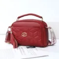 Stylish red quilted women crossbody shoulder bag with top handle, tassel and letter strap. - Jujube Red