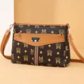 Women's vintage monogram crossbody bag with adjustable strap, stylish brown shoulder bag. - Letter M
