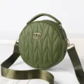 Green quilted round crossbody bag with top handle and wide strap for women fashion style. - Green