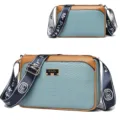Women's stylish blue and brown crossbody bag with snakeskin texture and wide strap. - Castle Blue