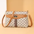 Stylish women's crossbody bag with vintage monogram pattern and brown leather trim, perfect for daily use. - White Letters