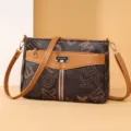 Stylish brown monogram crossbody shoulder bag for women with front pocket and metal logo plaque. - Letter Print