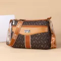 Stylish brown monogram crossbody shoulder bag with multi-zip compartments and wide strap. - Small Letter