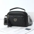Black PU leather shoulder bag for women, stylish quilted handbag with tassel and handle. - Black - Double Heart