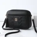 Elegant black leather crossbody shoulder bag for women with geometric quilted texture and tassel. - Black
