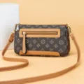 Vintage monogram shoulder bag for women, stylish crossbody bag with brown pattern and tan trim. - Monogram Print