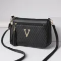 Black PU leather crossbody shoulder bag for women, trendy chevron quilted design with tassel. - Black