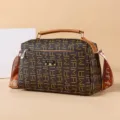 Fashionable brown monogram women's shoulder bag with stylish metal accent and durable strap. - Large Abstract Print