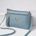 Blue crossbody shoulder bag for women, stylish PU leather handbag with zipper and tassel charm. - Castle Blue
