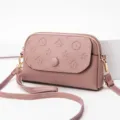 Women pinkish purple leather crossbody mini shoulder bag with chic embossed pattern. - Antler Purple