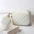 White quilted women crossbody bag with round pouch, stylish tassel, and comfortable strap. - Off White