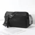 Black leather barrel handbag with wide strap tassel charm commuter shoulder crossbody bag - Tree Logo Style / Black