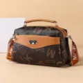 Retro brown monogram crossbody handbag for women with top handle and stylish letter printed strap. - Letter Print