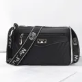 Black fashion casual crossbody shoulder bag with wide strap and metallic logo accent. - Black