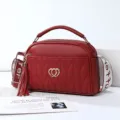 Elegant red faux leather shoulder bag with chic heart charm, tassel pendant and stylish strap. - Wine Red - Double Heart