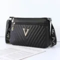 Black quilted shoulder bag with metal V logo and chic wide strap for women daily fashion. - Black