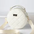 White round quilted crossbody bag with top handle and stylish shoulder strap for women. - White