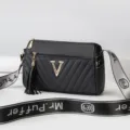 Black cylindrical women's crossbody shoulder bag with stylish metal V logo and tassel charm. - Black