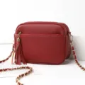 Red leather crossbody shoulder bag for women with chic tassel and gold chain strap. - Jujube Red