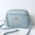 Light blue PU leather crossbody bag with tassel and zipper for women casual daily style. - Castle Blue