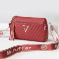 Red cylindrical crossbody shoulder bag for women with gold V logo and stylish wide strap. - Jujube Red