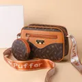 Brown monogram shoulder crossbody bag with round coin purse and wide web strap style. - Small Letter