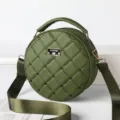 Green round quilted crossbody bag for women with chic heart embroidery and top handle. - Green