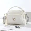 White PU leather women handbag with quilted design, double heart metal buckle, and tassel. - Off-White - Double Heart