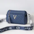 Blue cylinder shoulder bag, stylish crossbody handbag with V logo and chic strap for women. - Dark Blue