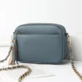 Trendy blue leather crossbody bag for women, featuring a chic chain strap and stylish tassel detail. - Blue
