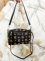 Multi-layer brown monogram crossbody bag with adjustable strap and large capacity for daily use. - Letter M