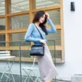 Women casual black shoulder bag with floral embossed pattern and elegant crossbody design. - Black