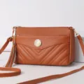Stylish brown leather crossbody bag with multi-layer zipper compartments and cute tassel charm. - Yellow Brown