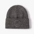 Dark gray knitted beanie for women and men, stylish warm winter hat with embroidered smiley face - One Size / Dark Gray
