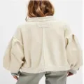 Back detail view of women vintage knit cardigan, featuring puff sleeves and raw seam lines. - Off White