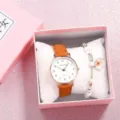 Detailed view of women quartz watch with brown leather strap and pink gift box set. - Coffee