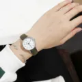 Minimalist quartz watch with green strap and white dial, elegant student exam timepiece. - Women's Green Strap Watch with White Dial