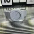 Grey plastic quartz watch with integrated band octagonal bezel minimalist dial closeup detail view - Gray (Scale Style)