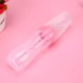 Pink silicone baby food squeeze bottle with an integrated spoon for easy infant feeding. - Pink