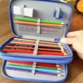 Multi-layer blue pencil case set with colored pencils, eraser, sharpener, and ruler for kids. - 35-Piece Colored Pencil Set / Blue