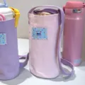 Sac de bouteille d'eau en toile avec sangle, motif de chien mignon, porte-boisson portable. - Sac à Bouteille Rose en Toile Crossbody / Rose
