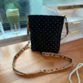 Black crossbody bag for women, stylish polka dot design with colorful woven strap for daily commute. - Vertical / Black Polka Dot
