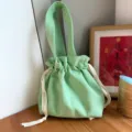 Green canvas drawstring bag, minimalist solid color bento lunch tote for daily use. - Fruit Green