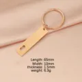 Rose gold stainless steel keychain with hollow heart tag, compact size and stylish design. - Rose Gold